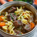 German beef noodle soup, served in a bowl.