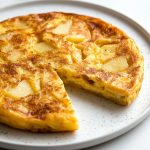 Frittata di Patate, served on a white plate.