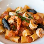 Frutti Di Mare (Italian Seafood Pasta), served on a white plate.