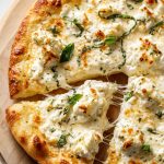 White Pizza (Pizza Bianca) with ricotta, mozzarella, basil, and a crispy golden crust