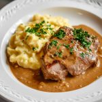 Rahmschnitzel (German Cream Schnitzel), served with mashed potatoes.