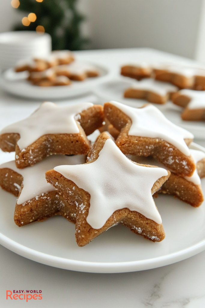 Zimtsterne (German Cinnamon Star Cookies), served on a white plate.
