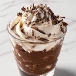 French Chocolate Mousse Topped with whipped cream and chocolate shavings.