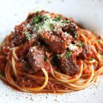 Italian Sunday Sauce, served over spaghetti.